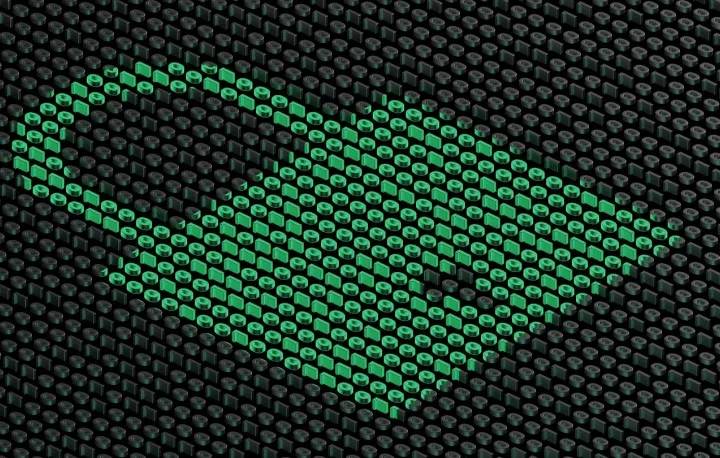 A pixelated green heart on a dark display